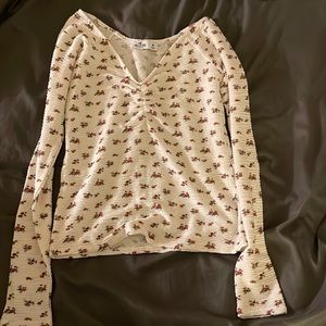 it’s white with pink flowers on it and perfect for the winter